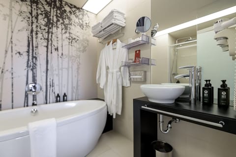 Suite, 1 King Bed, Non Smoking | Bathroom | Bathtub, free toiletries, hair dryer, bathrobes