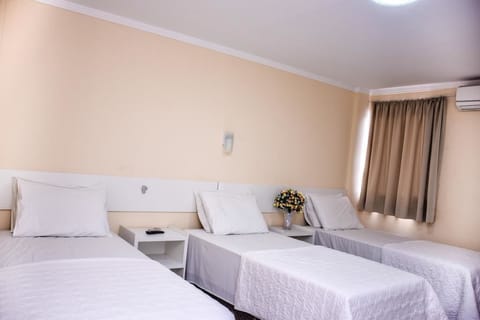 Triple Room | Minibar, desk, blackout drapes, free WiFi