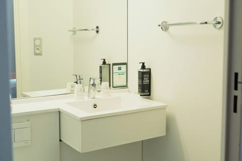 Shower, eco-friendly toiletries, towels, soap