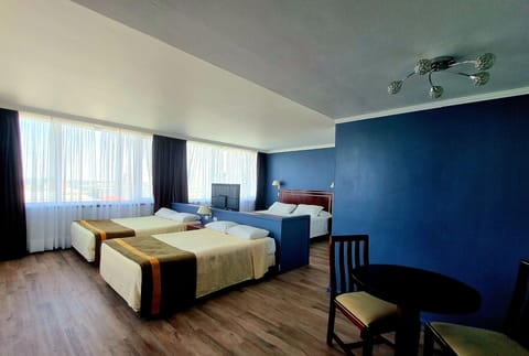 Executive Triple Room | Minibar, in-room safe, individually decorated, individually furnished