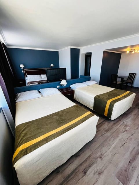 Executive Triple Room | Minibar, in-room safe, individually decorated, individually furnished