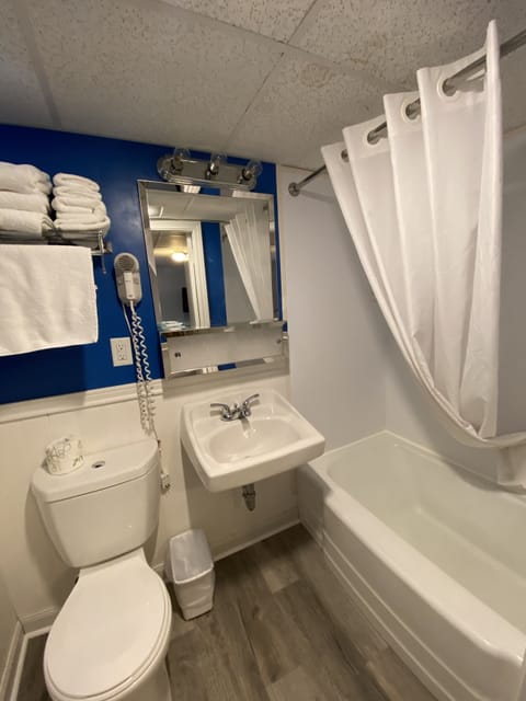 Economy Room, 2 Queen Beds | Bathroom | Shower, towels