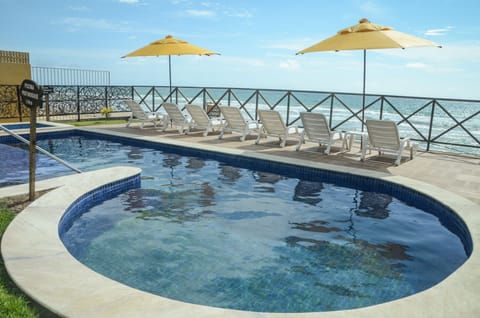 Outdoor pool, open 8:00 AM to 8:00 PM, pool umbrellas, sun loungers