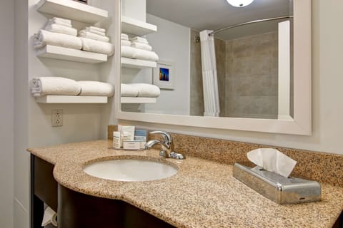 Standard room with two queen beds | Bathroom | Combined shower/tub, free toiletries, hair dryer, towels