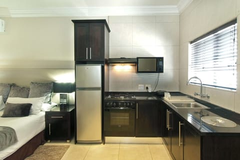 Executive Self-Catering Suite | Private kitchen | Coffee/tea maker