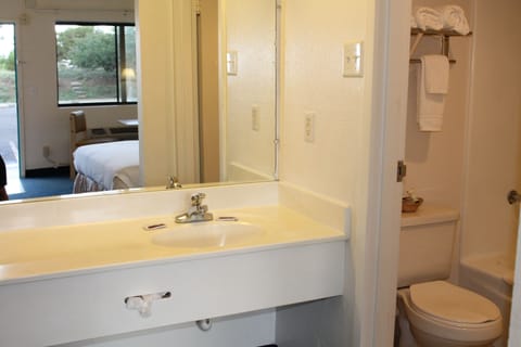 Standard Double Room, 2 Queen Beds | Bathroom | Combined shower/tub, free toiletries, towels