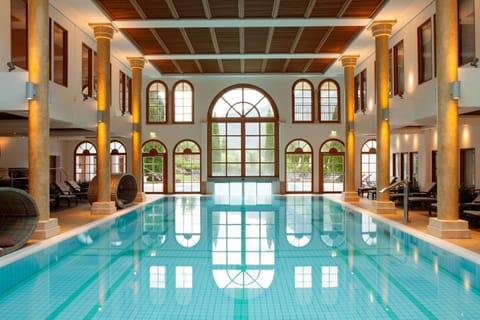 Indoor pool, outdoor pool, pool umbrellas, sun loungers