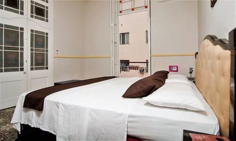 Superior Room | Minibar, in-room safe, iron/ironing board, bed sheets