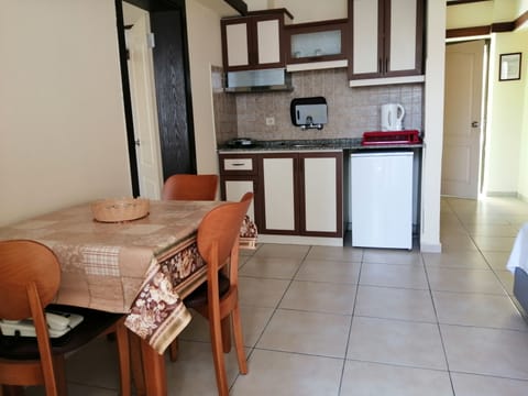 Apartment | Private kitchen | Fridge, stovetop, electric kettle, cookware/dishes/utensils