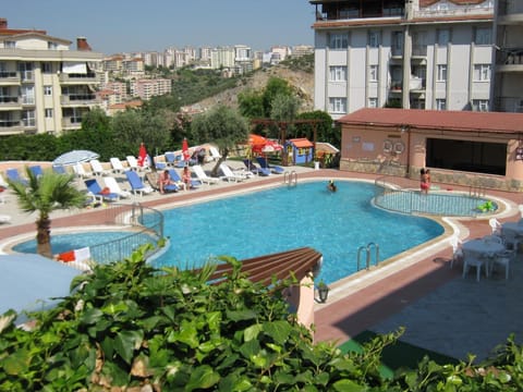 Outdoor pool, pool umbrellas, sun loungers