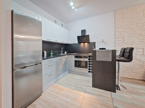 Apartment (Homely) | Private kitchen | Fridge, microwave, oven, stovetop