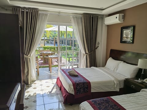 Deluxe Twin Room, Pool View | In-room safe, desk, blackout drapes, free WiFi