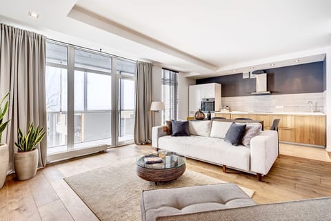 Deluxe Apartment, 1 Bedroom, Accessible, Balcony | Living area | 115-cm flat-screen TV with cable channels, TV