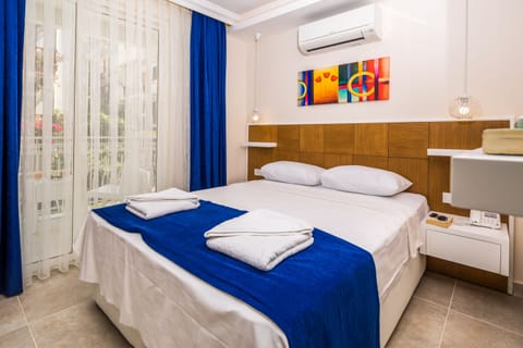 Economy Double Room, 1 Double Bed, City View | Minibar, in-room safe, soundproofing, rollaway beds