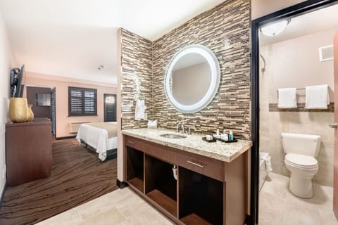 Suite, 1 King Bed, Balcony | Bathroom | Combined shower/tub, free toiletries, hair dryer, towels