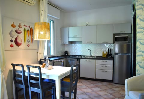 Deluxe Apartment, 2 Bedrooms | Private kitchen | Fridge, microwave, stovetop, dishwasher