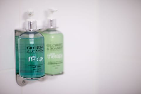 Combined shower/tub, hair dryer, towels, toilet paper