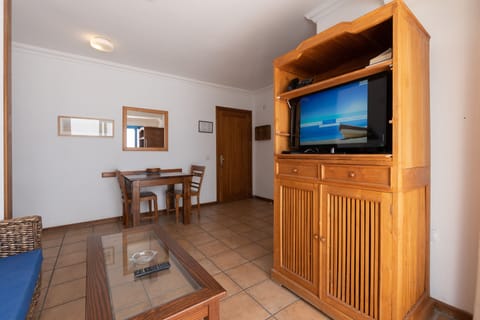 Economy Apartment | Living room | 22-inch plasma TV with satellite channels, TV