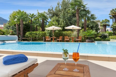 Outdoor pool, pool umbrellas, sun loungers