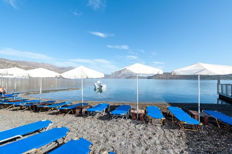 On the beach, sun loungers, beach umbrellas