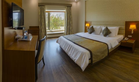 Deluxe Room, City View | Premium bedding, in-room safe, desk, iron/ironing board