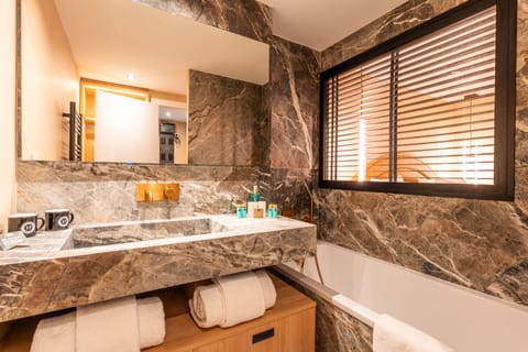 King Suite with Balcony | Bathroom | Designer toiletries, hair dryer, bathrobes, slippers