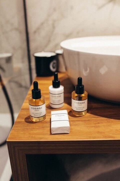 Designer toiletries, hair dryer, bathrobes, slippers