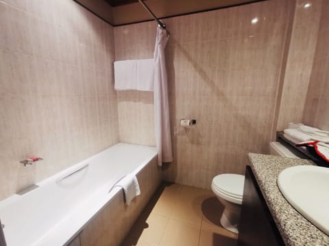 Deluxe Room | Bathroom | Hair dryer, slippers, towels, soap
