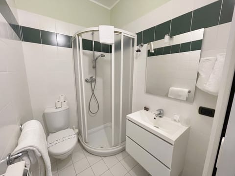 Economy Room, 1 Bedroom | Bathroom | Shower, rainfall showerhead, free toiletries, hair dryer