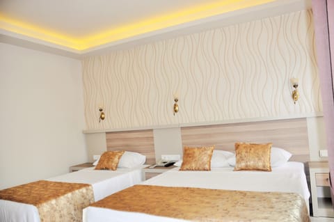 Standard Double Room, Partial Sea View | Minibar, in-room safe, desk, free WiFi