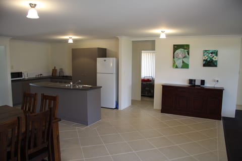 House, 4 Bedrooms, 2 Bathrooms | Private kitchen | Full-size fridge, microwave, oven, stovetop