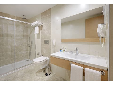 Suite, 1 King Bed with Sofa bed, Balcony, Corner | Bathroom | Shower, designer toiletries, hair dryer, slippers