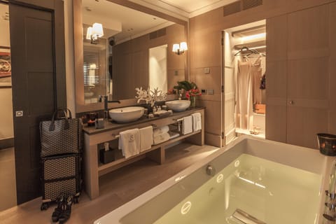 Suite, Hot Tub (Eight Suite) | Bathroom | Rainfall showerhead, hair dryer, bathrobes, slippers