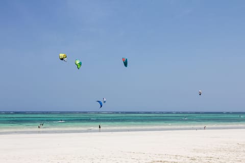 On the beach, white sand, sun loungers