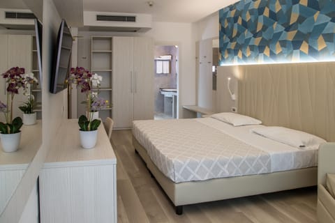 Triple Room, Balcony | In-room safe, desk, free WiFi, bed sheets