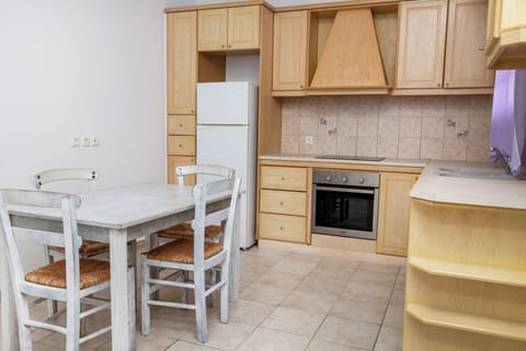 Family Apartment, 2 Bedrooms | Private kitchen | Mini-fridge, stovetop, highchair, cookware/dishes/utensils