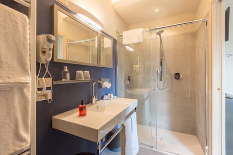 Shower, free toiletries, hair dryer, slippers