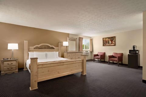 Suite, 1 King Bed | Desk, blackout drapes, iron/ironing board, free cribs/infant beds