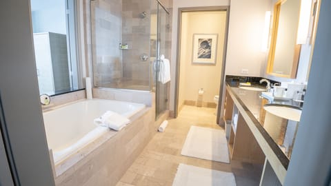 Separate tub and shower, designer toiletries, hair dryer, bathrobes