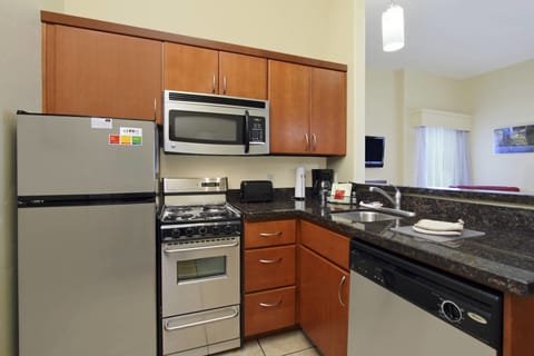 Suite, 2 Bedrooms | Private kitchen | Fridge, microwave, stovetop, dishwasher