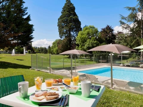 Seasonal outdoor pool, open 10:00 AM to 8:00 PM, pool umbrellas