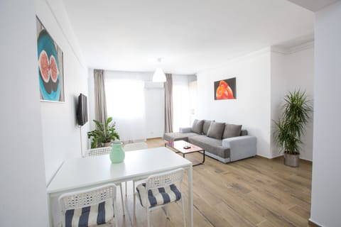 Apartment, 1 Bedroom | Living room | Flat-screen TV