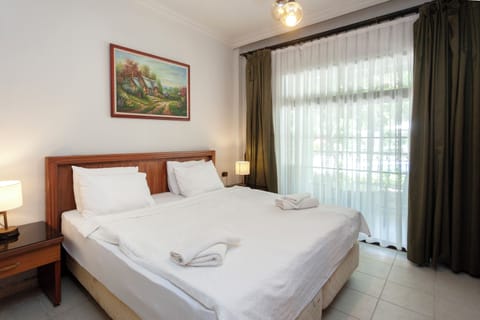 Comfort Quadruple Room, Pool View, Poolside | Premium bedding, minibar, desk, laptop workspace