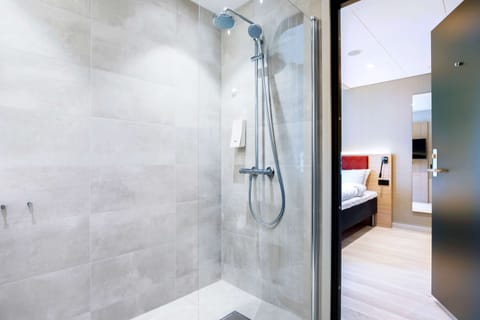 Shower, rainfall showerhead, hair dryer, towels