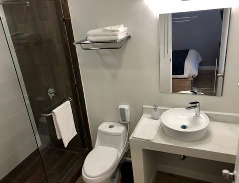 Standard Room, 1 Queen Bed | Bathroom | Shower, hair dryer, bathrobes, towels