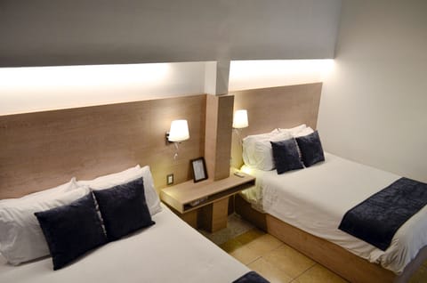 Room, 2 Queen Beds | Minibar, free WiFi, bed sheets