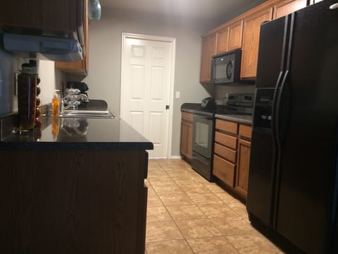 Full kitchen w/stove, refrigerator, dishwasher, microwave, coffeemaker & toaster