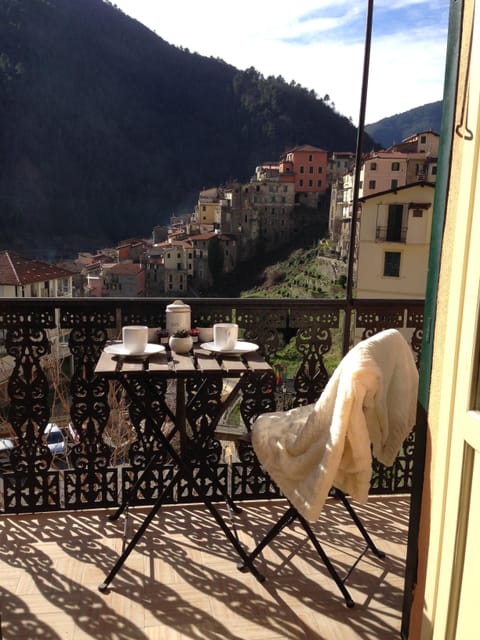 The apt has a big terrace (8 m wide and 1 m deep) with several tables and chairs