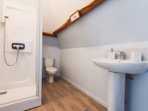 En suite shower room and toilet to bedroom 1.