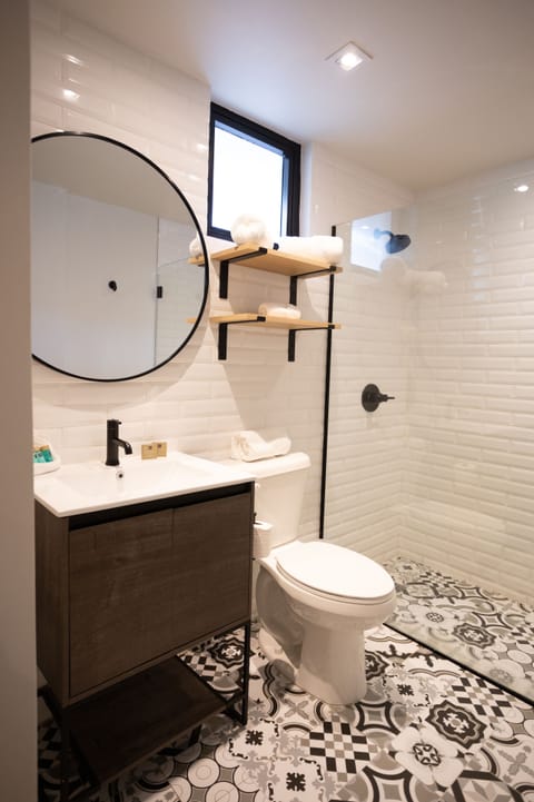 Modern Queen | Bathroom | Shower, free toiletries, hair dryer, towels